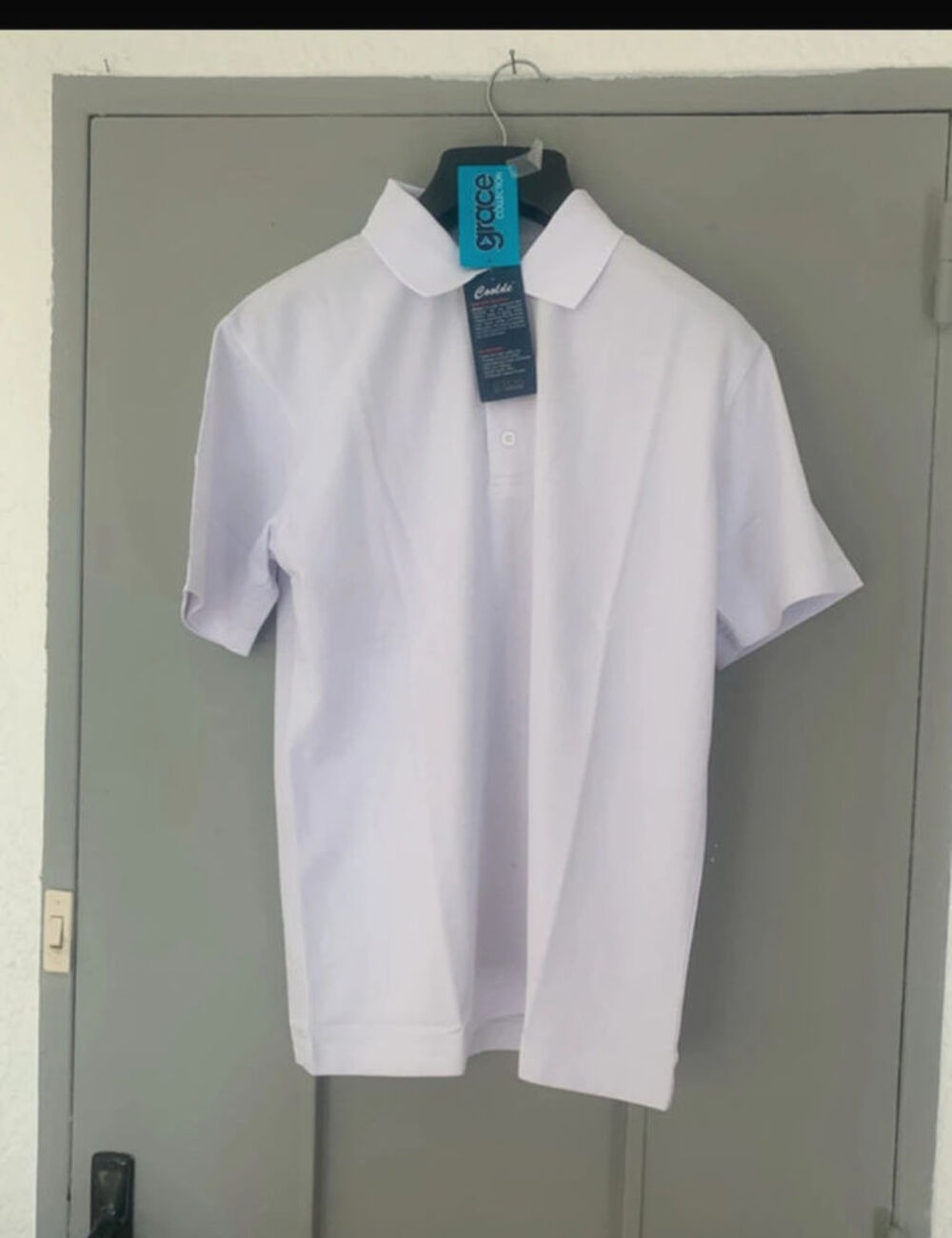 Polo blanc Marque Grace
Collection - Taille S Vêtements