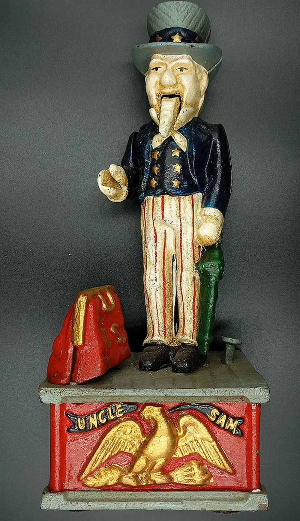 Tirelire m&eacute;canique vintage am&eacute;ricaine en fonte Oncle Sam 