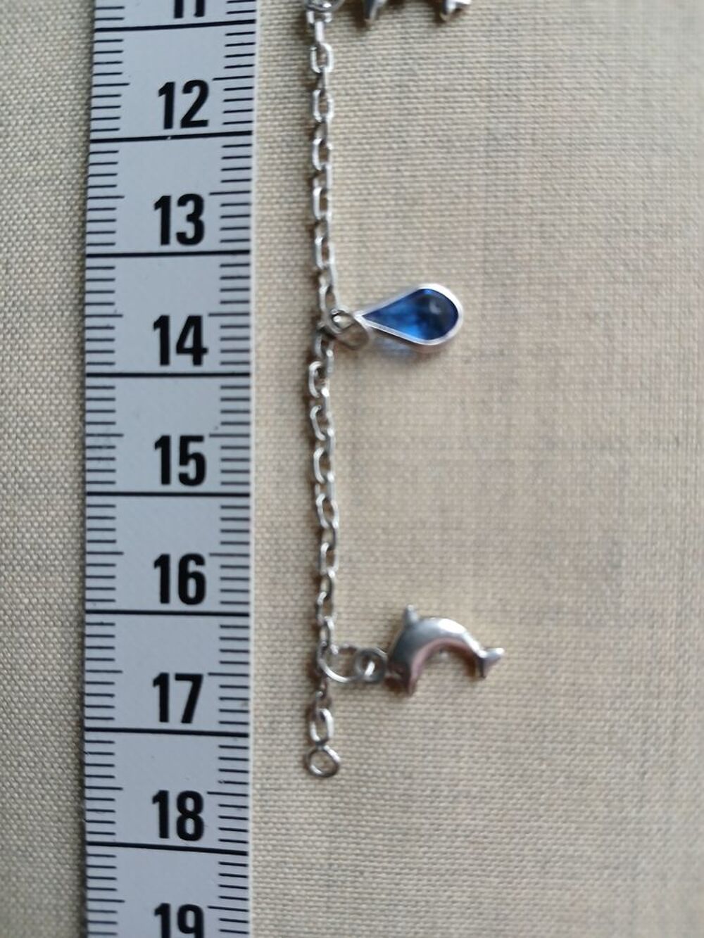 BRACELET AVEC PENDENTIFS DAUPHIN ET GOUTTE D'EAU BLEUE Bijoux et montres