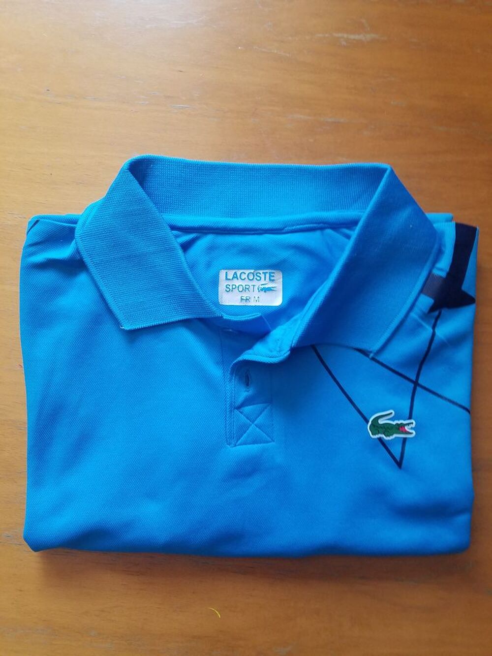 Polo bleu Lacoste en bon &eacute;tat Vêtements