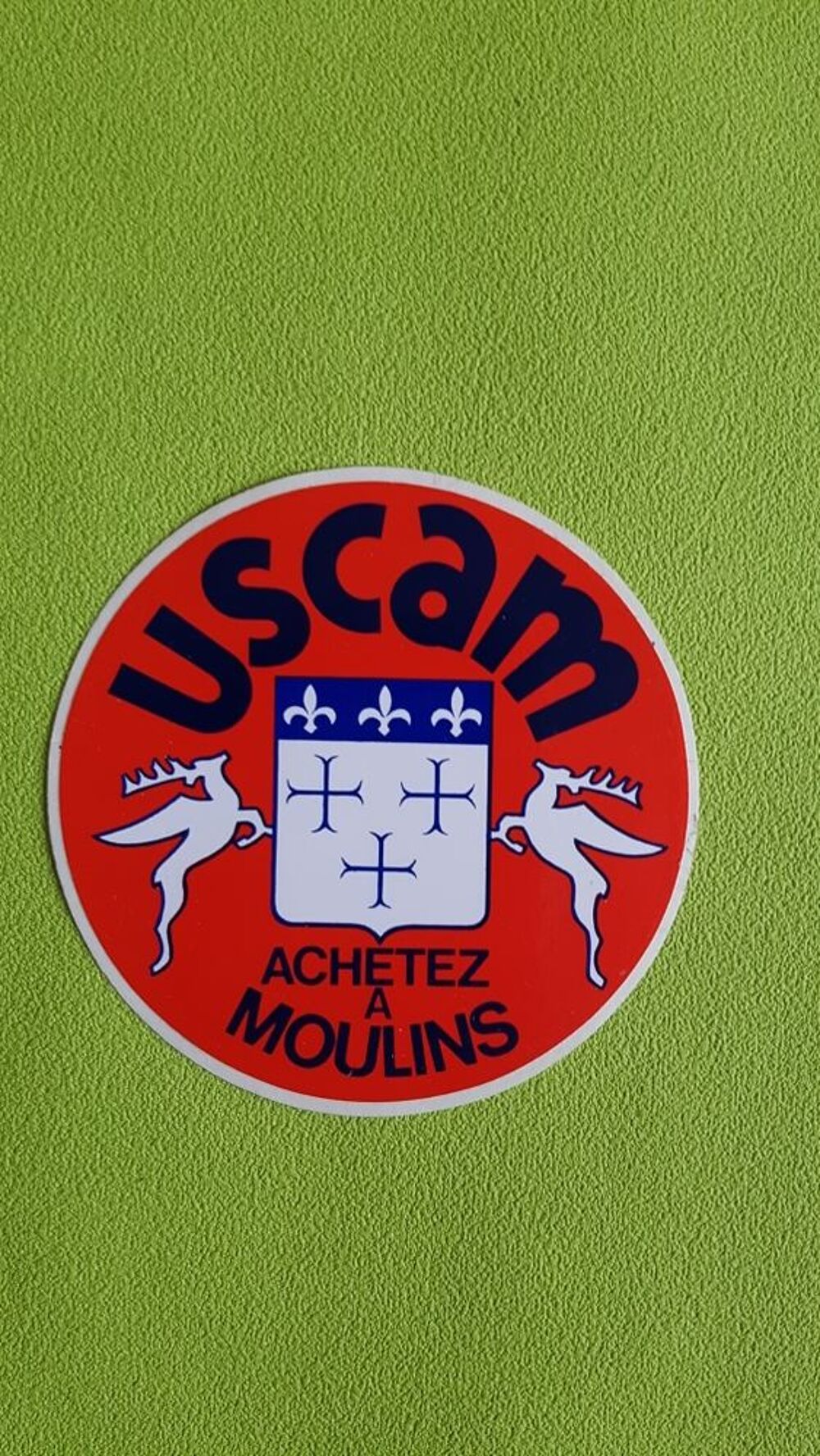 AUTOCOLLANT USCAM 