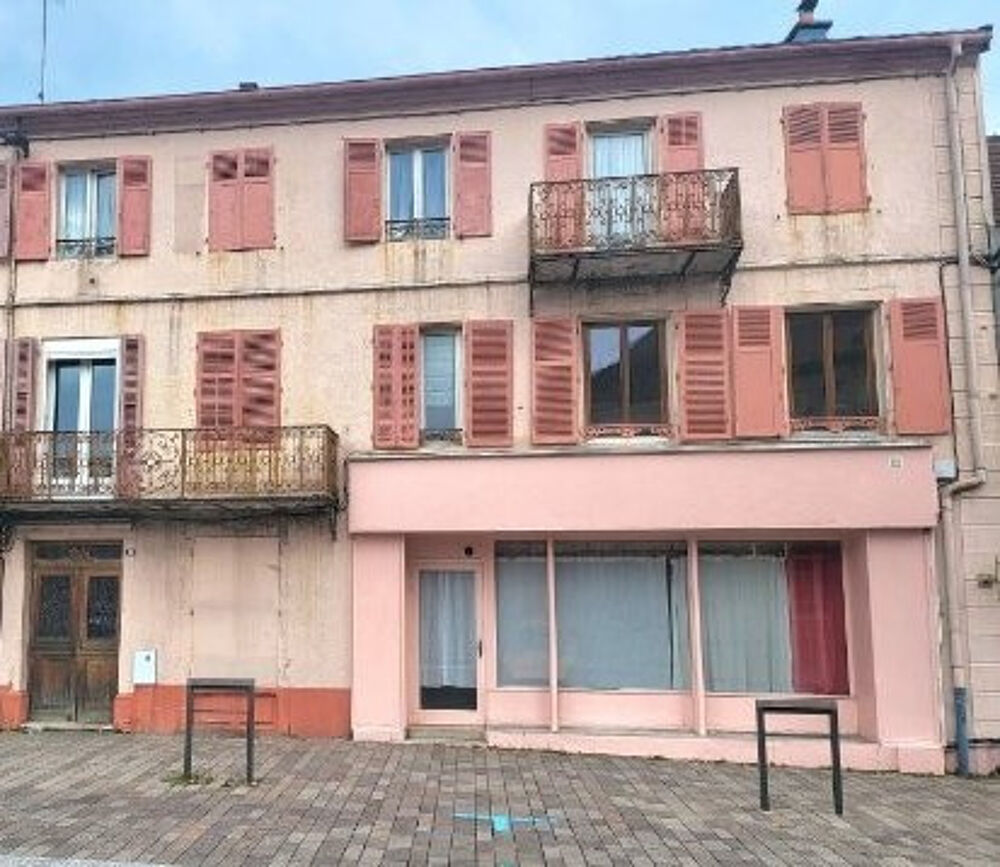 Immeuble comprenant 6 appartements + une surface commerciale
