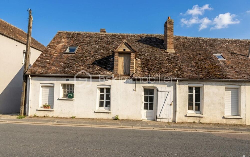 Maison de ville avec grand potentiel, garage et jardin