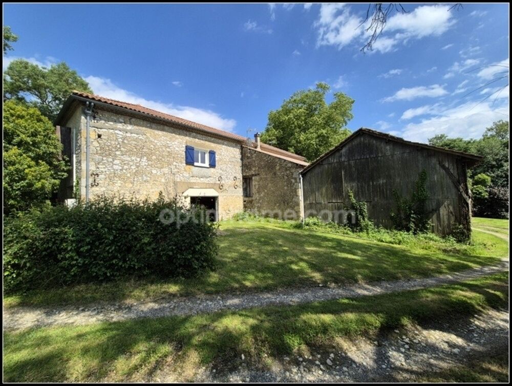 Maison en pierre avec dépendances, piscine, et terrain à Saint Puy