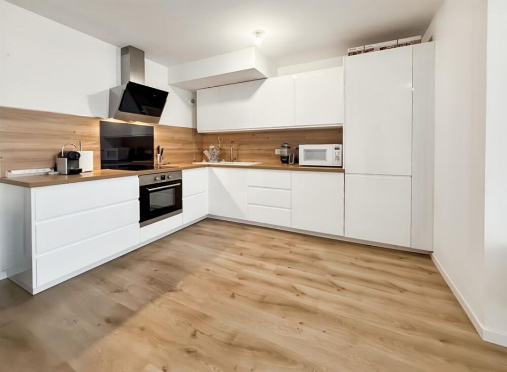 Appartement 3 pièces de 71 m2 avec jardin et 2 places de stationnement en sous-sol
