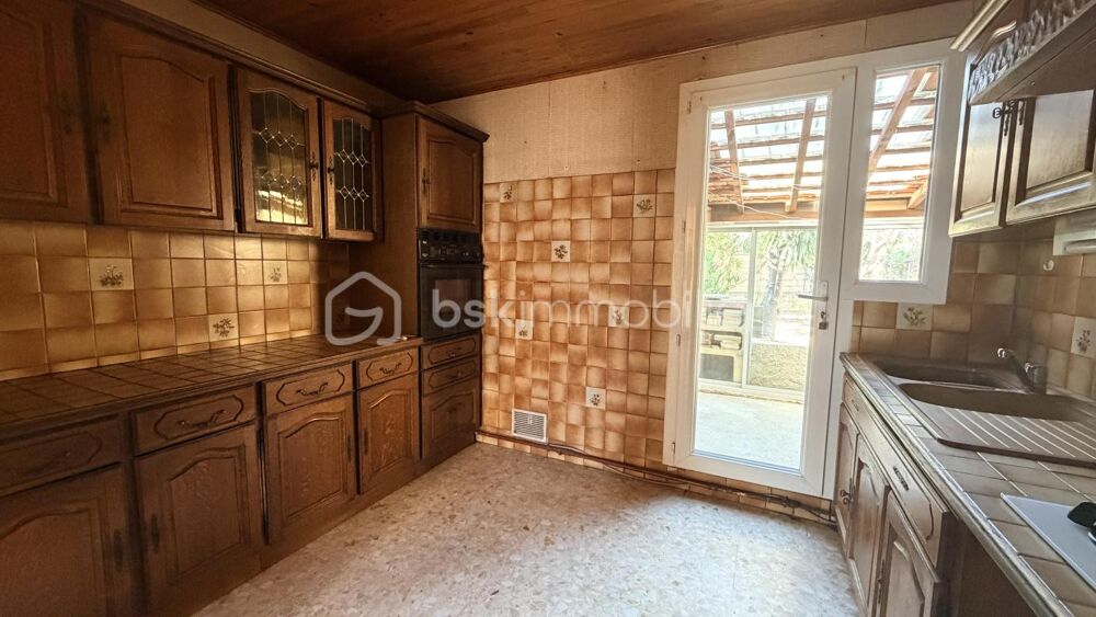 MAISON EN DEUX FACES AVEC GARAGE ET JARDIN