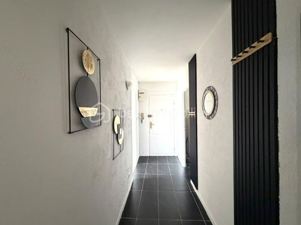 appartement spacieux avec cave, balcon et place de parking