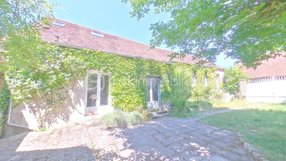 Propriété comprenant deux habitations avec cave et jardin