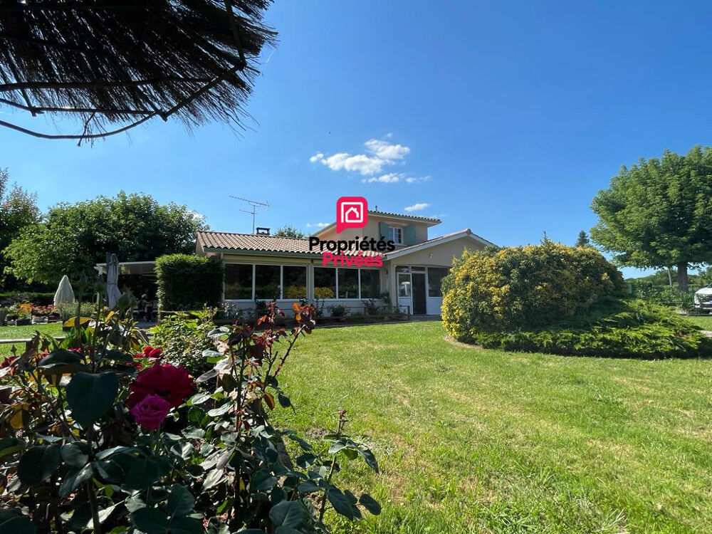 Propriété familiale avec piscine chauffée et parc arboré