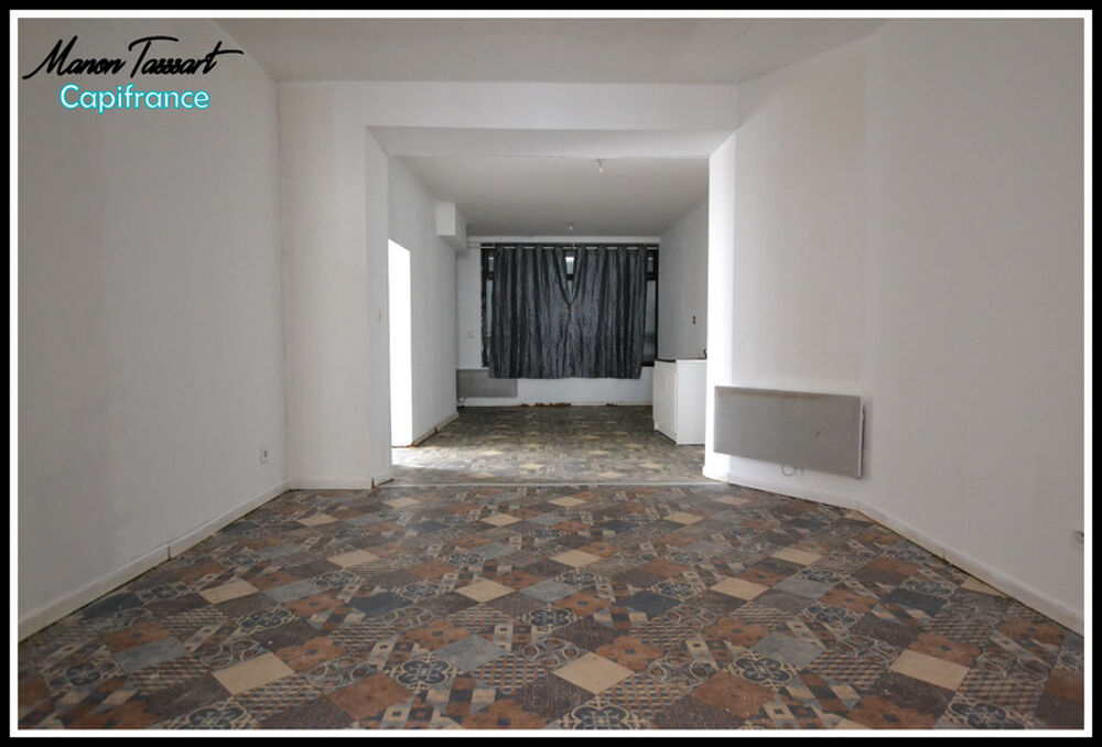 Maison de ville de 102m² en semi plain pied, 2 chambres, 1 bureau avec garage, cour et jardinet