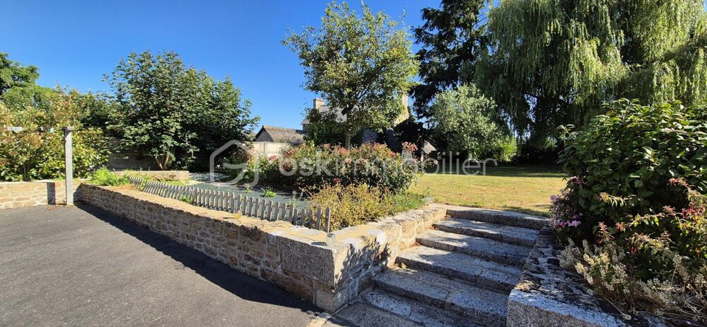 Maison familiale en pierre 161m2 avec 5 chambres, jardin arboré et vie tout à pied à Javené