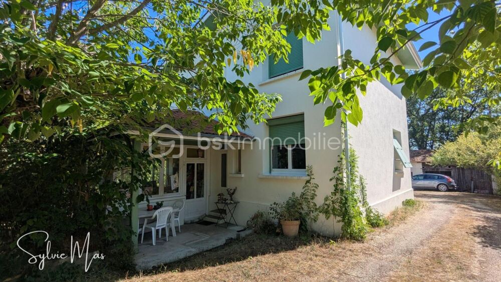 Maison avec jardin arboré, garage et puits