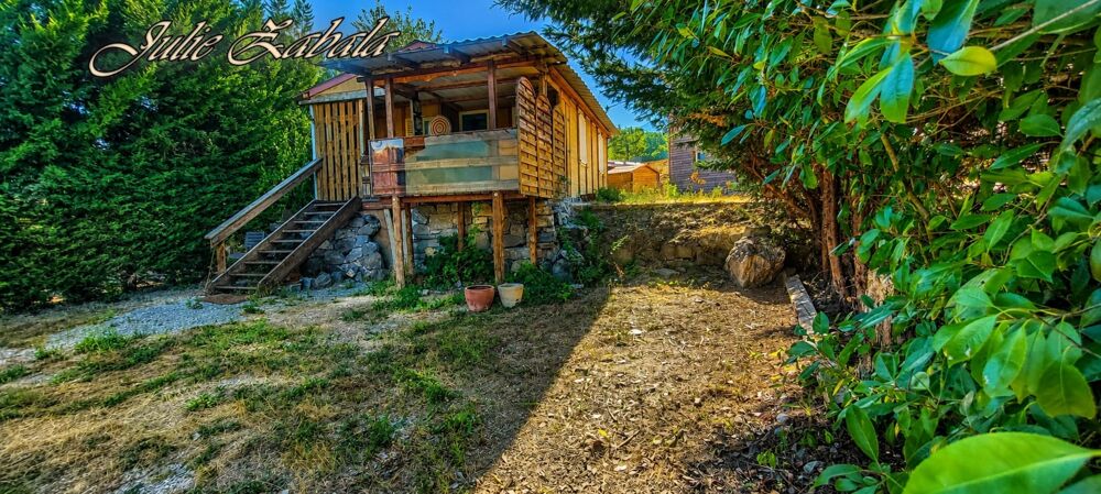 Bungalow en bois avec terrain privatif, terrasse et cave  PRL