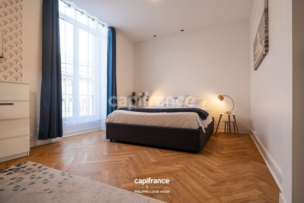 APPARTEMENT DE STYLE HAUSSMANNIEN D'EXCEPTION AVEC GRANDE PIÈCE À VIVRE DE PLUS DE 70M2