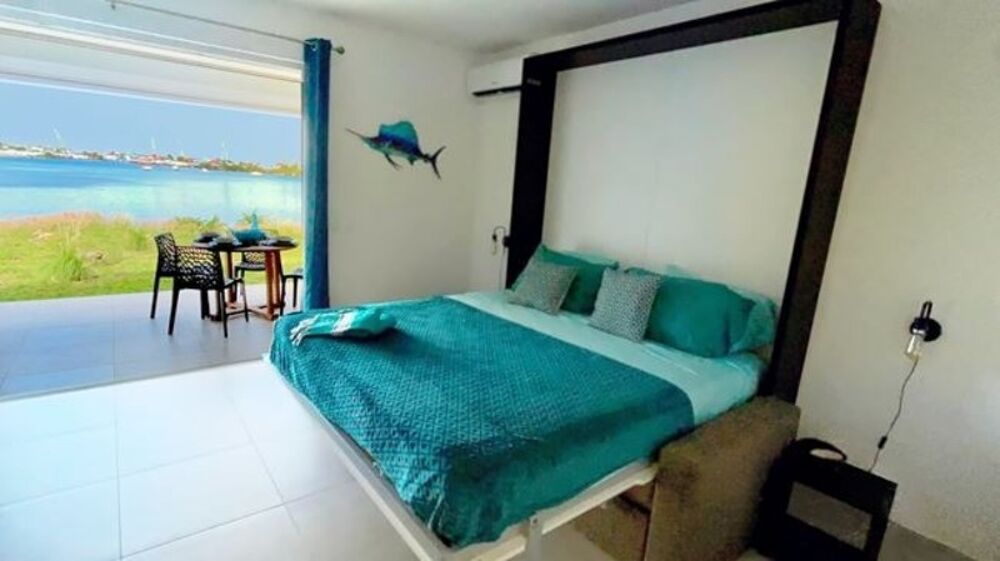 À VENDRE STUDIO RÉCENT EN REZ-DE-JARDIN AVEC VUE LAGON SECTEUR BELLEVUE, SAINT-MARTIN (97150)