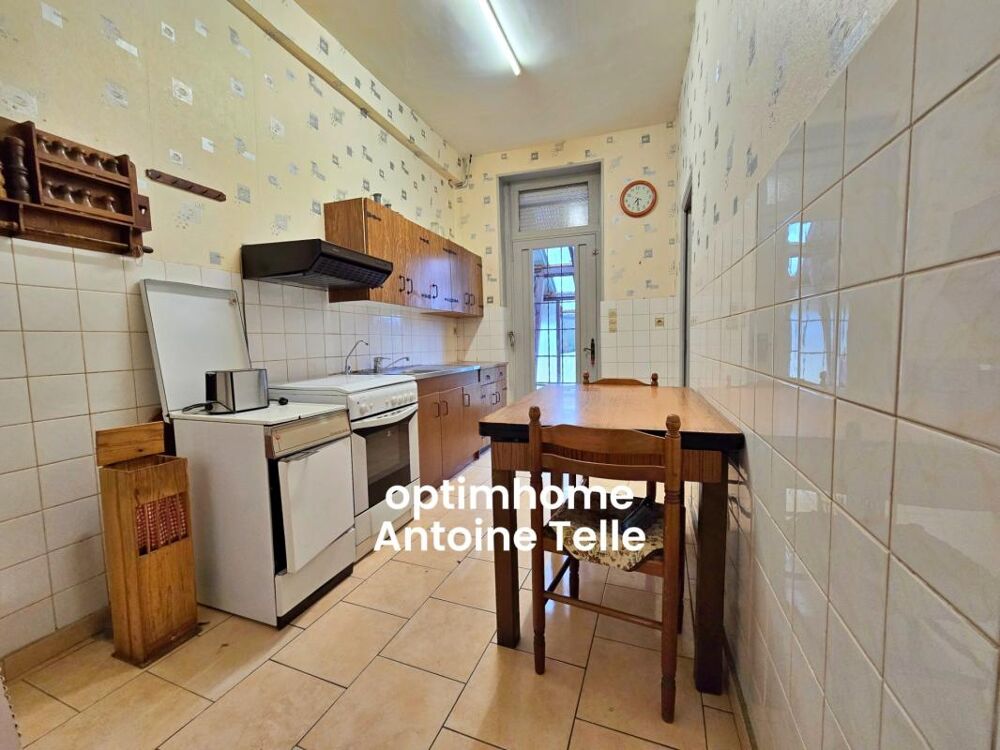 Le Cateau - Maison semi-individuelle à double accès avec garage, devanture & jardin clos sur 960m²