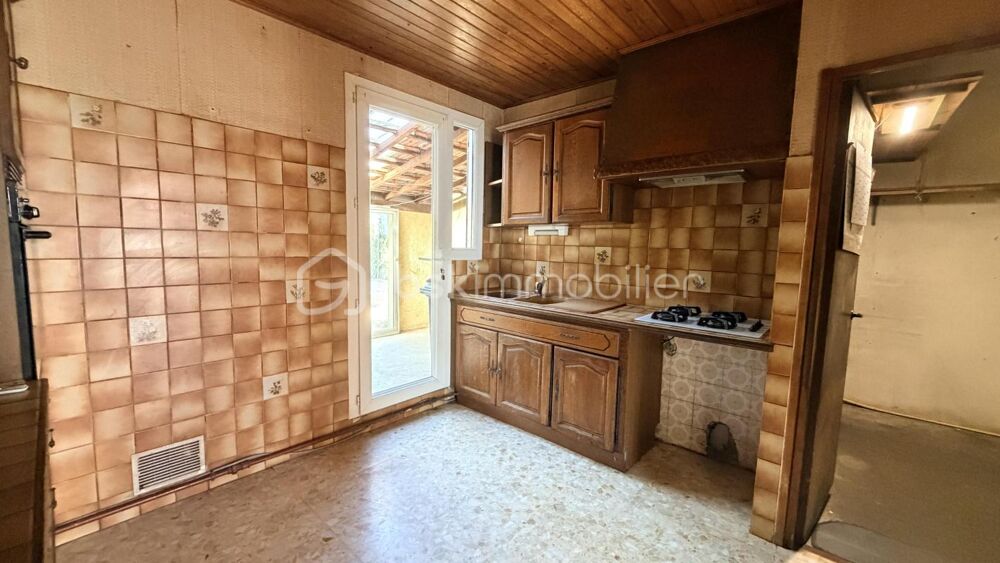 MAISON EN DEUX FACES AVEC GARAGE ET JARDIN
