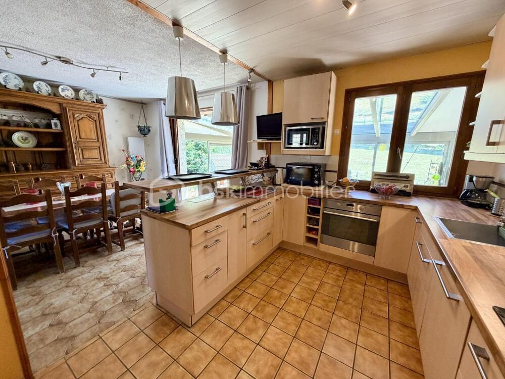 Maison 5 pièces avec véranda, sous-sol complet, grand garage et jardin