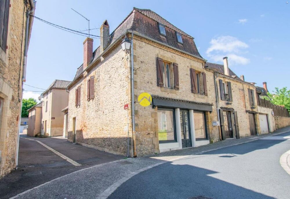 Immeuble avec commerce et app. 2 ch