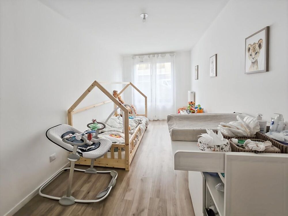 Appartement 3 pièces de 71 m2 avec jardin et 2 places de stationnement en sous-sol
