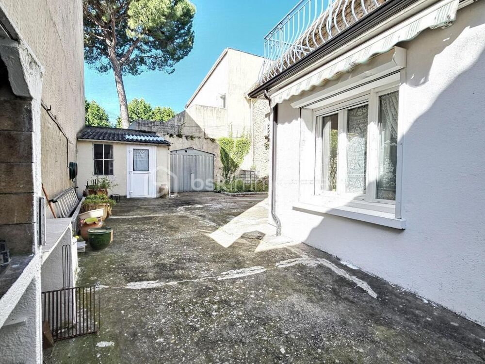 Maison familiale avec cour, grand garage et climatisation réversible  Un bien rare au coeur de Milhaud !