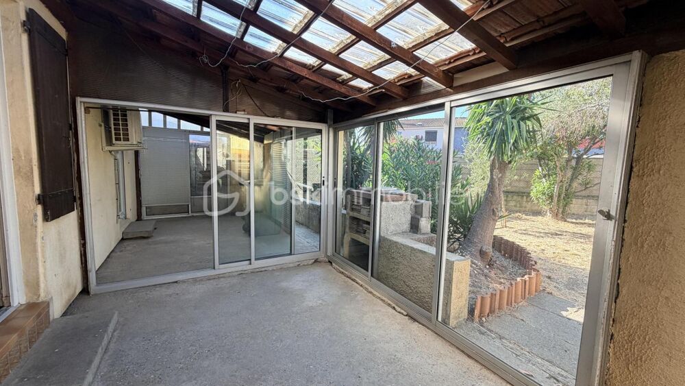 MAISON EN DEUX FACES AVEC GARAGE ET JARDIN
