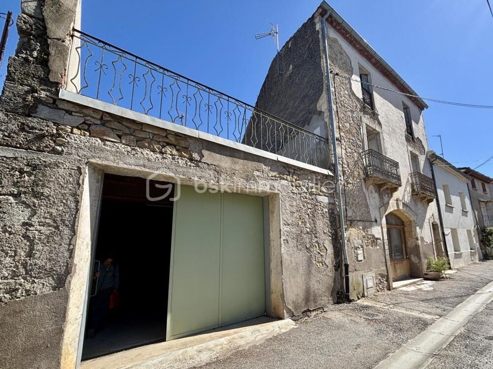 RARE  Maison en pierre avec terrasse, garage et atelier. Enorme potentiel daménagement