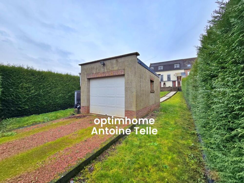 Le Cateau - Maison semi-individuelle à double accès avec garage, devanture & jardin clos sur 960m²