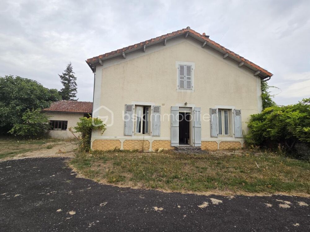 Maison à rénover avec potentiel, grand garage et jardin clos de 1200 m²