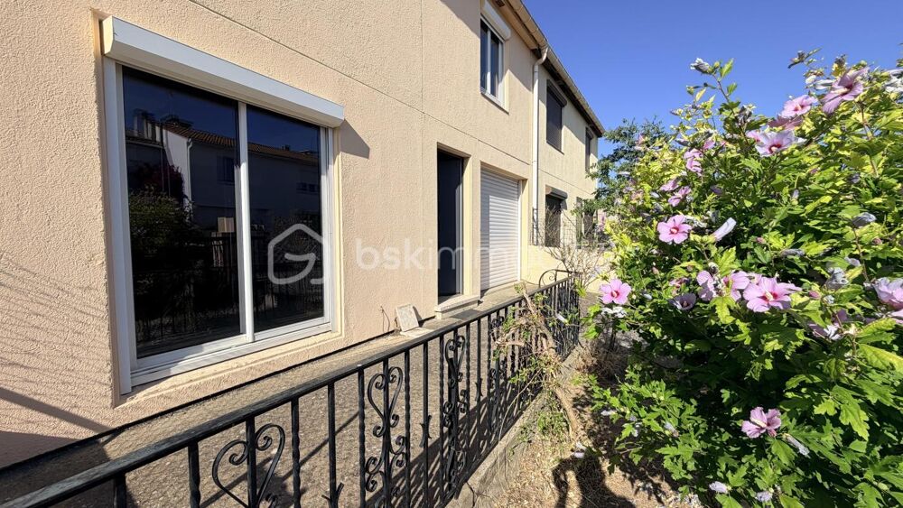 MAISON EN DEUX FACES AVEC GARAGE ET JARDIN