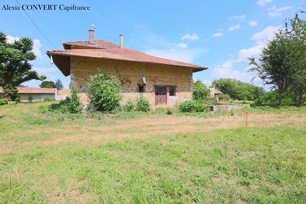 Dépendance 115m² avec 946m² de terrain proche centre village Foissiat