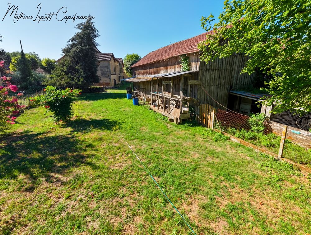 A vendre Maison en pierre de caractère de 240 m², pigeonnier, ancien séchoir à tabac et terrain clos de 2 065 m²  Lalinde 24150