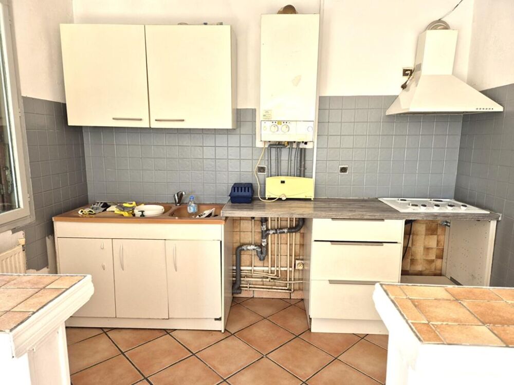 Belle Maison Individuelle de 75 m² à Rénover et Extensible à 100 m² avec Cour, Garage, Terrasse, Véranda et Terrain clos et arbo