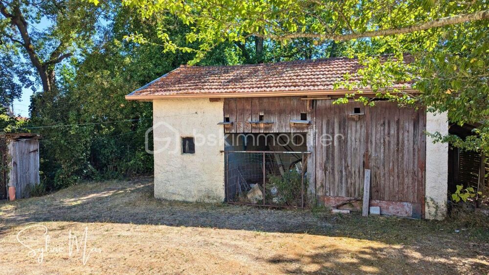 Maison avec jardin arboré, garage et puits