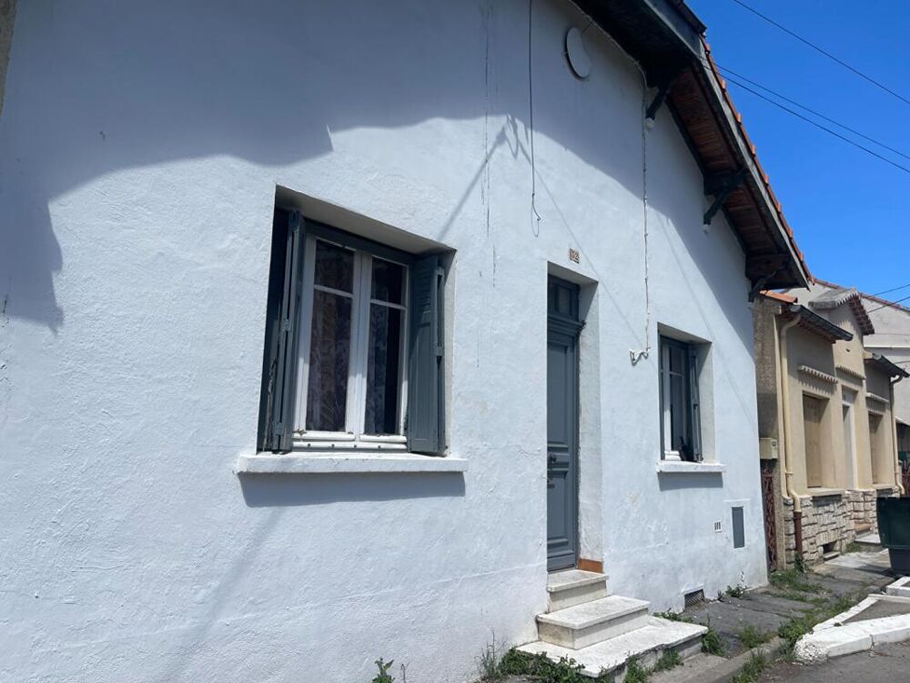 A vendre maison mitoyenne 3 pièces de 65 m2 avec grand garage sur terrain de 295 m2