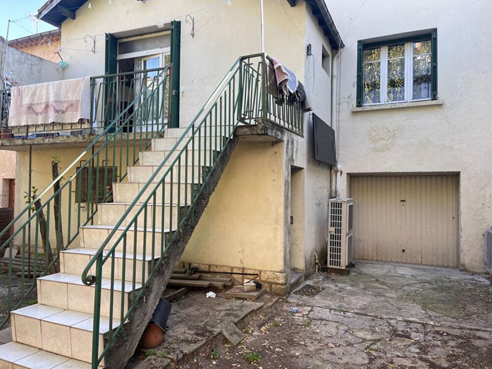 A vendre maison mitoyenne 3 pièces de 65 m2 avec grand garage sur terrain de 295 m2