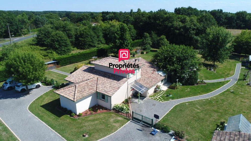 Propriété familiale avec piscine chauffée et parc arboré