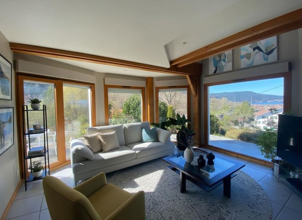 Vente Chalet Gérardmer - Chalet pièce de vie vue lac, 4 chambres, 2 garages  151 m²  DPE C Gerardmer