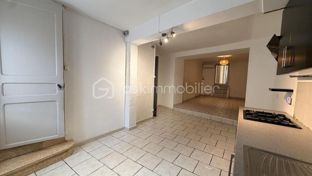 MAISON DE VILLAGE EN DEUX FACES AVEC GARAGE ET JARDIN