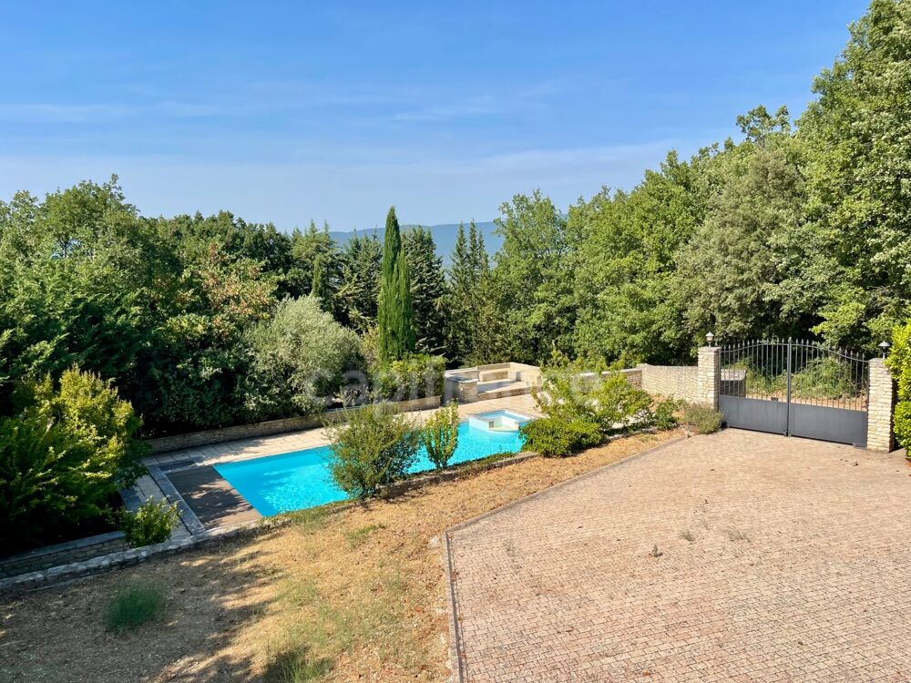 À vendre  Maison avec piscine et grand terrain arboré à Saignon (84400)