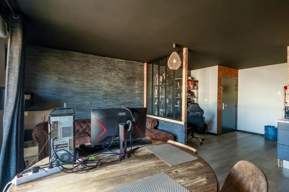 Appartement T3 de 58,27 m² avec balcon, carport et stationnement