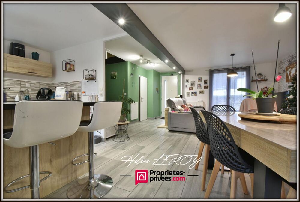 Maison individuelle avec garage et jardin dans quartier calme