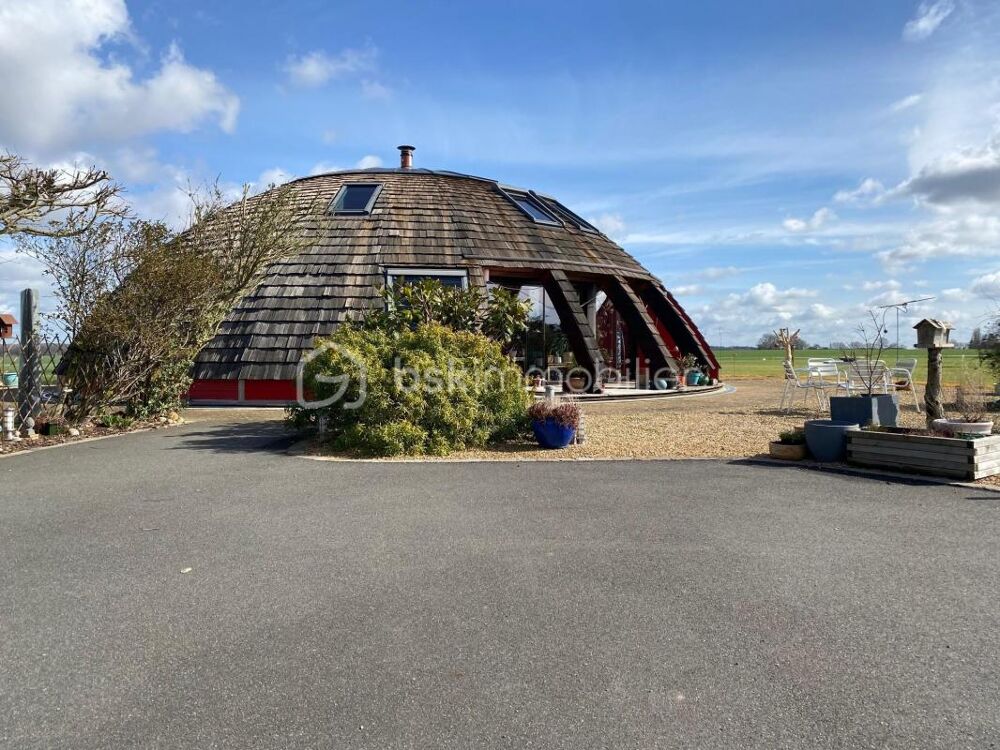 MAISON RONDE EN BOIS QUI TOURNE AVEC LE SOLEIL