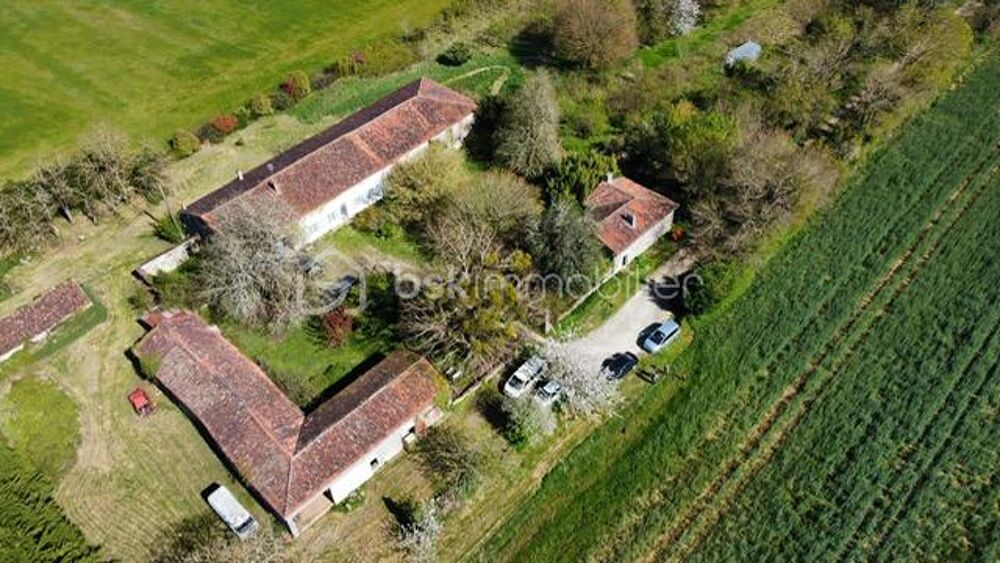 2 maisons d'habitation, dépendances, 1ha de terrain