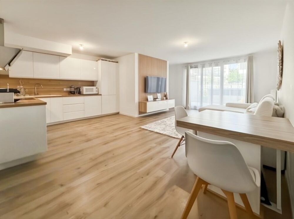 Appartement 3 pièces de 71 m2 avec jardin et 2 places de stationnement en sous-sol