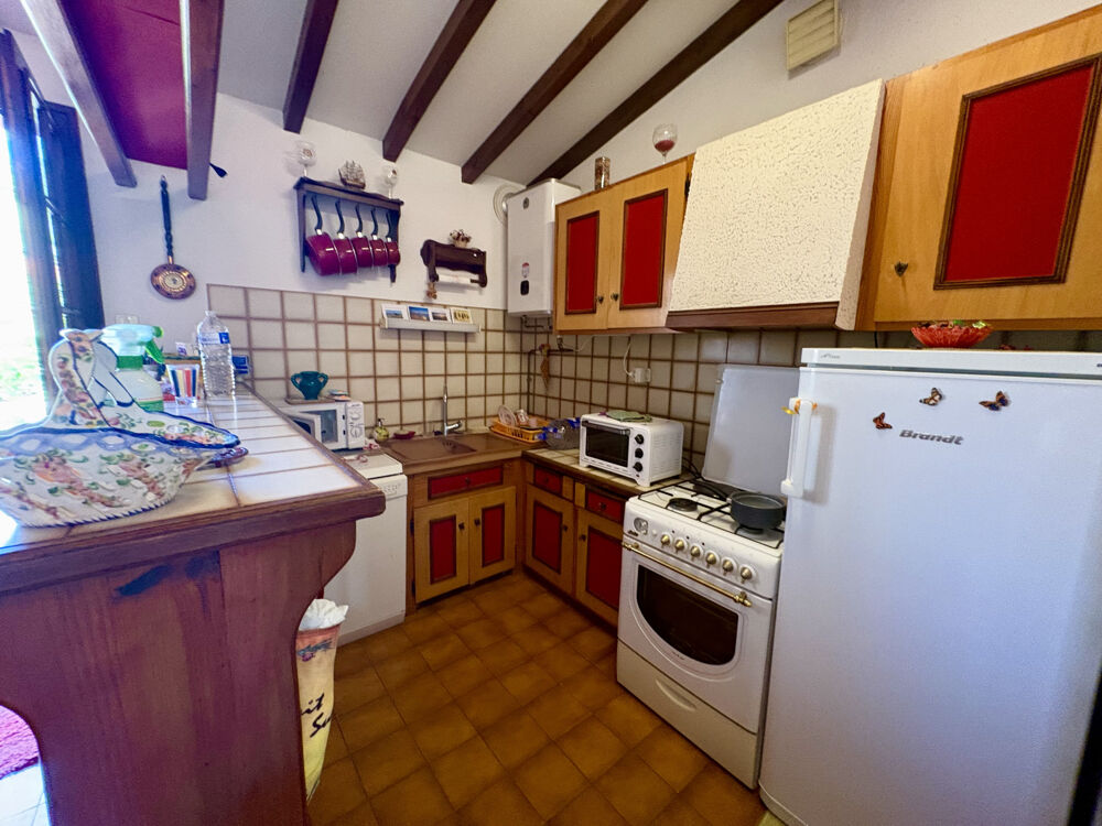 Maison 2 faces sur terrain arboré de 342 m2