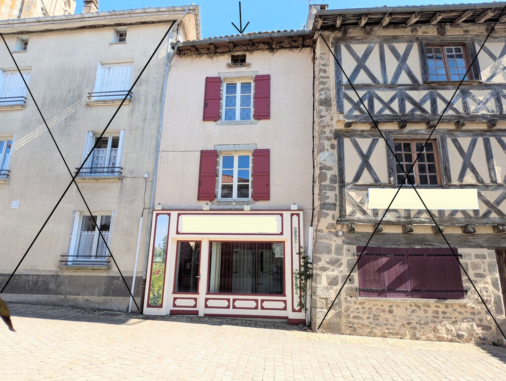 DANS UN VILLAGE AGREABLE , ANCIEN IMMEUBLE À RÉNOVER À USAGE DE COMMERCE ET D'HABITATION AVEC GARAGE