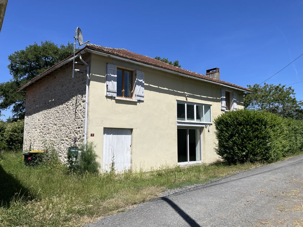 DANS UN ENDROIT VERDOYANT, ANCIENNE GRANGE EN PIERRE CONVERTIE EN HABITATION AVEC TERRAIN