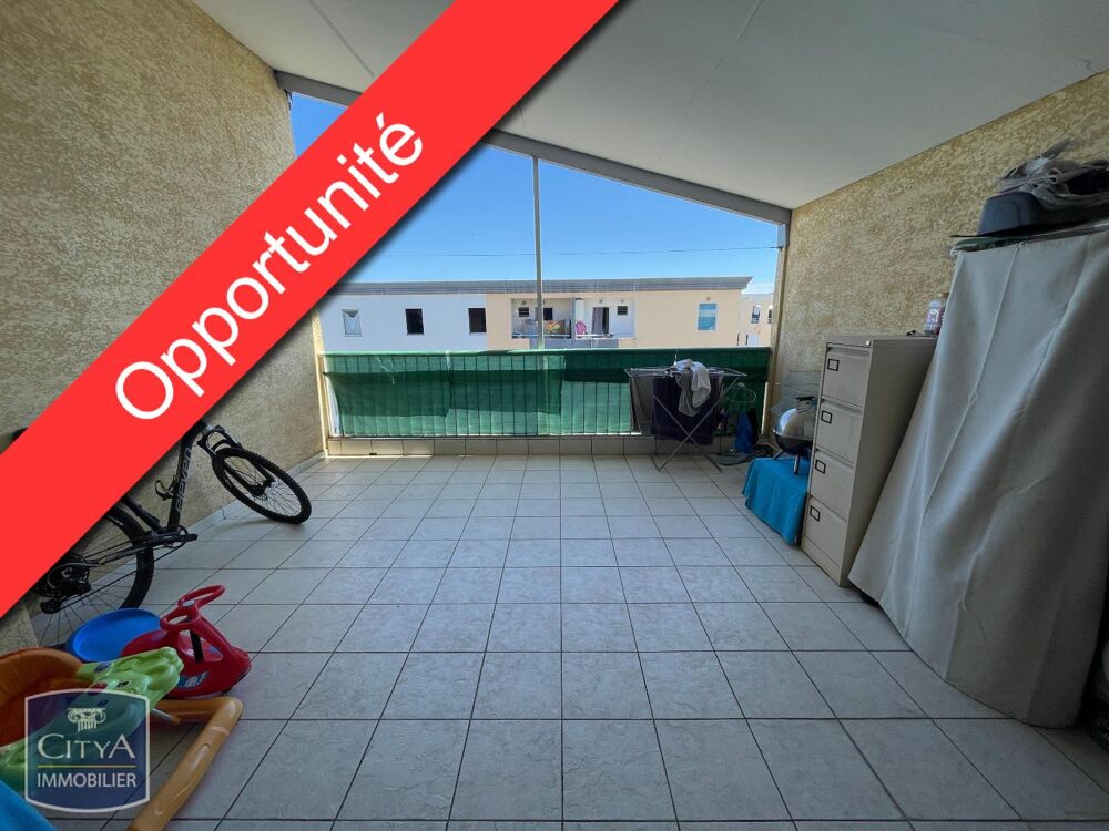 IDEALEMENT SITUE - T3 VACANT DERNIER ETAGE - LE PORT (97....