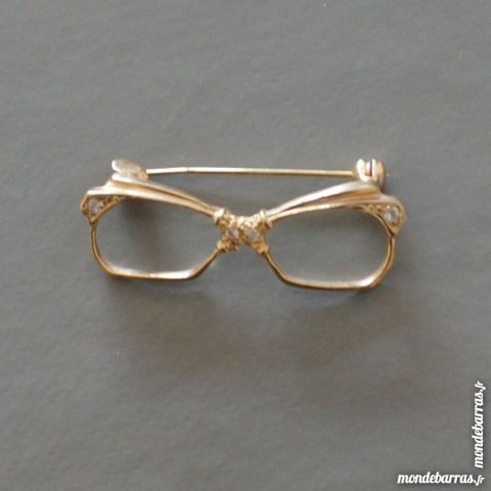 Broche lunette dor&eacute;e sertie de 4 brillants Bijoux et montres